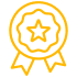 Médaille d'or stylisée avec une étoile centrale et des rubans en dessous, symbolisant l'excellence, la qualité ou une récompense.